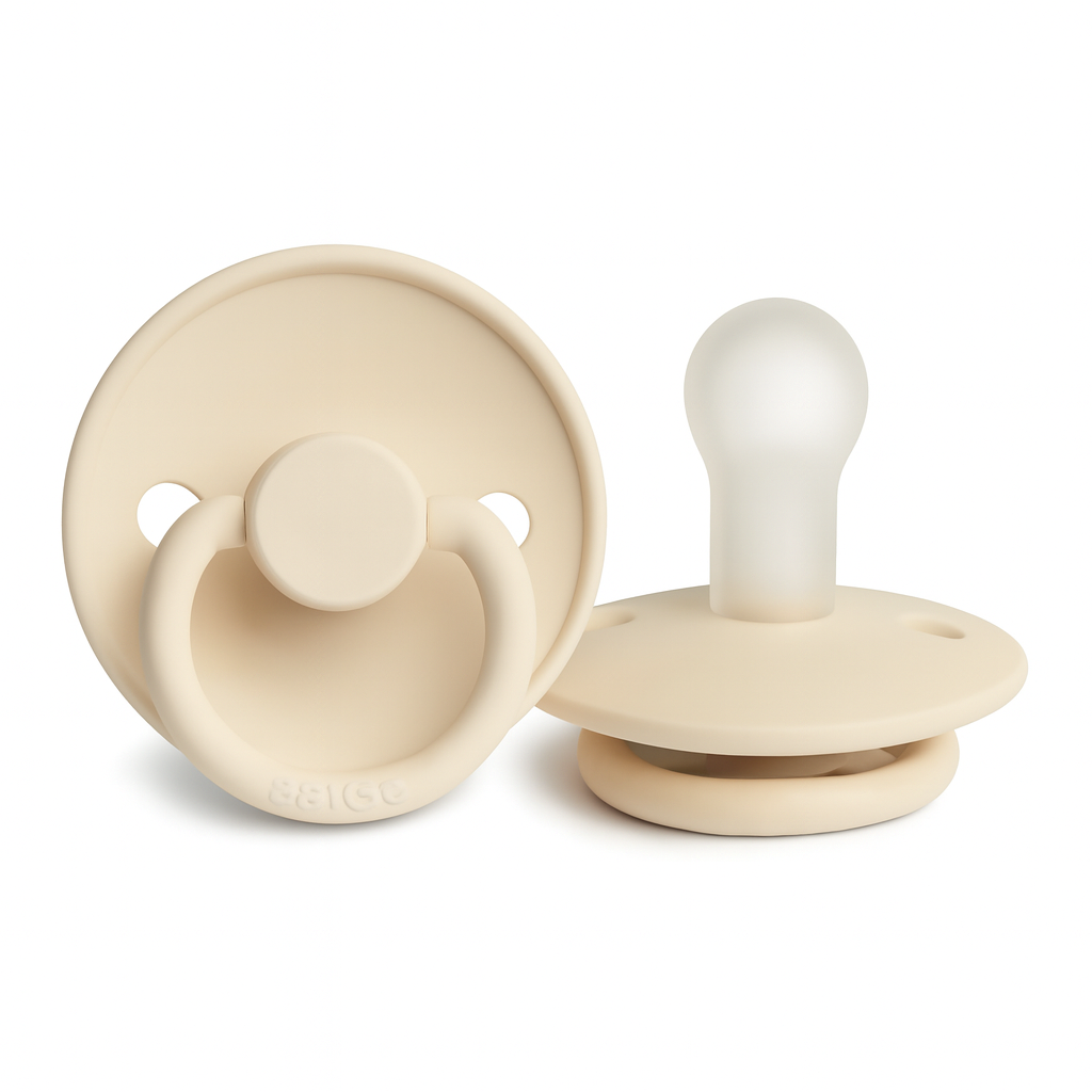 Beige baby pacifiers with circular shield and rounded nipple, isolated on a pure white background.