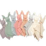 Pastel-colored baby bunny comforters with stitched eyes and long ears, arranged in a row on transparent background soft textured fabric ideal for newborn comfort and sleep.
